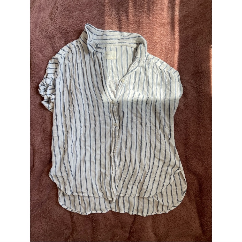 Striped blue and white shirt.